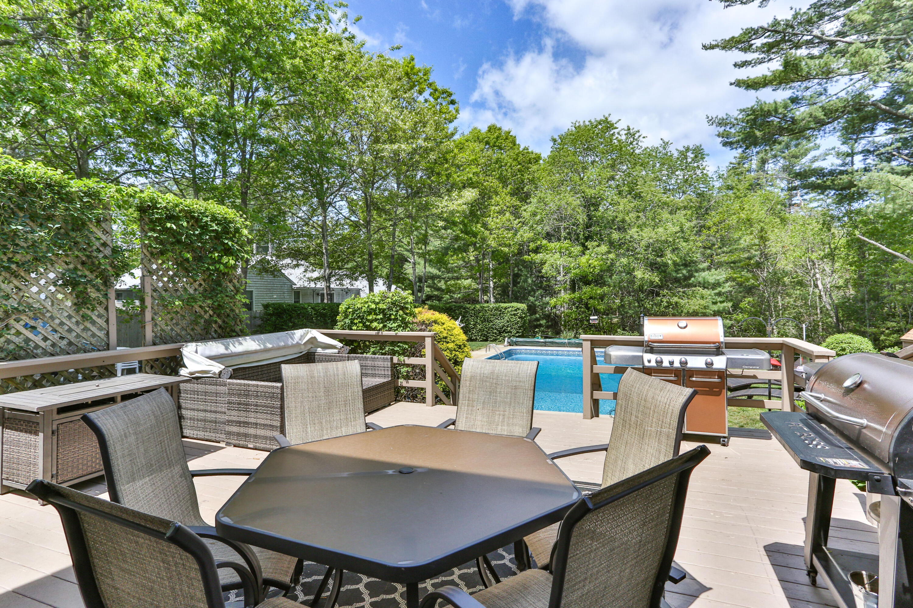 138 Gunstock Road Osterville, MA 02655 - Photo 37 of 47 a view of a backyard with table and chairs