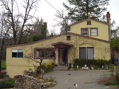 499 White Cottage Road South Angwin, CA 94508 - Photo 6 of 10 a front view of a house with garden