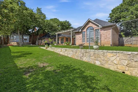 a front view of a house with a fence