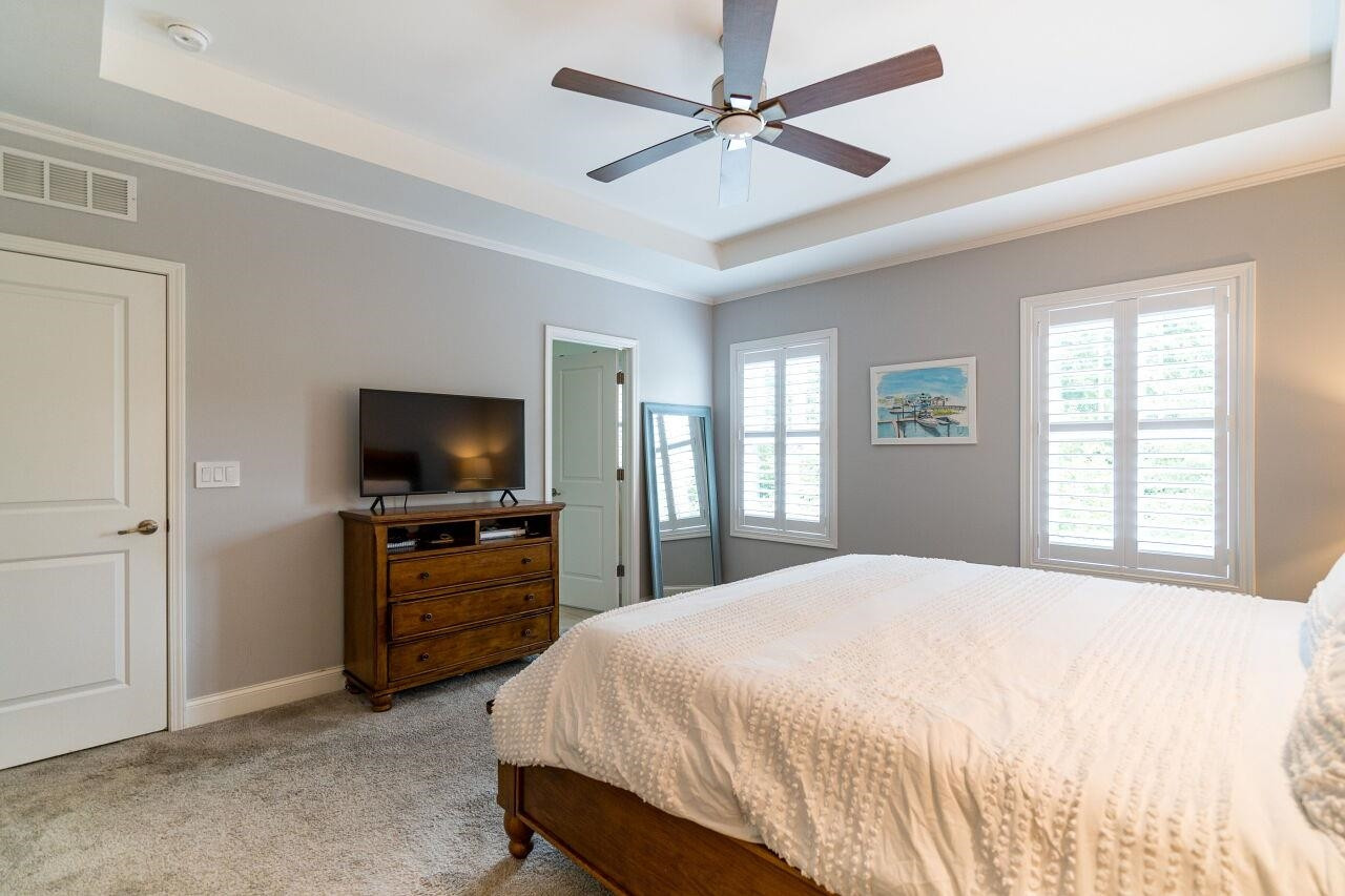 1517 Fullerton Place Raleigh, NC 27607 - Photo 20 of 30 Owner's suite w/ tray ceiling, recessed lighting, fan, shutters, WIC w/ stunning California Closets built in & en suite bath. Owner's Suite