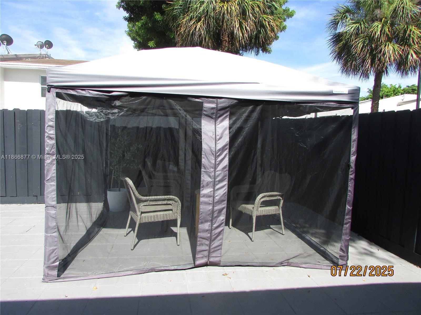 5620 Southwest 140th Place Miami, FL 33183 - Photo 3 of 12 a view of table and chair in the patio