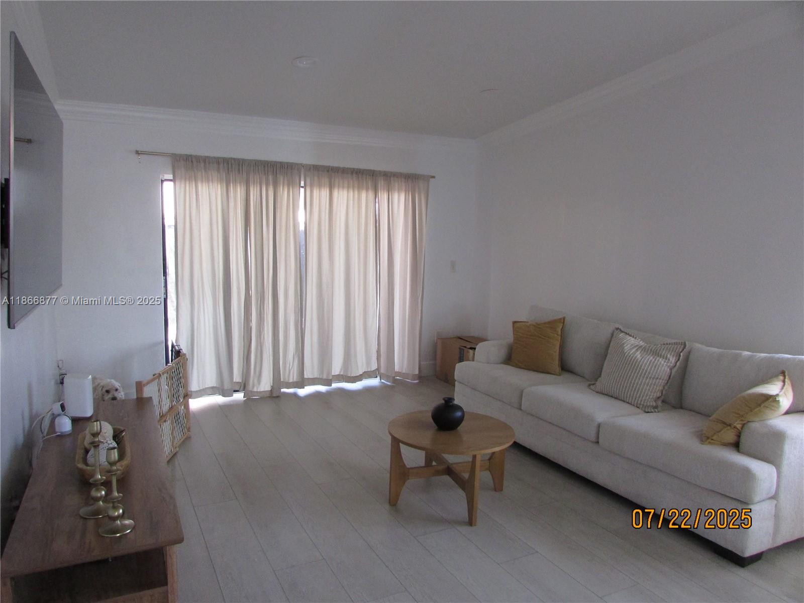 5620 Southwest 140th Place Miami, FL 33183 - Photo 10 of 12 a living room with furniture and wooden floor