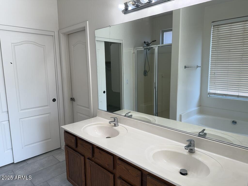 20915 East Via Del Rancho Queen Creek, AZ 85142 - Photo 17 of 23 a bathroom with a sink and a mirror