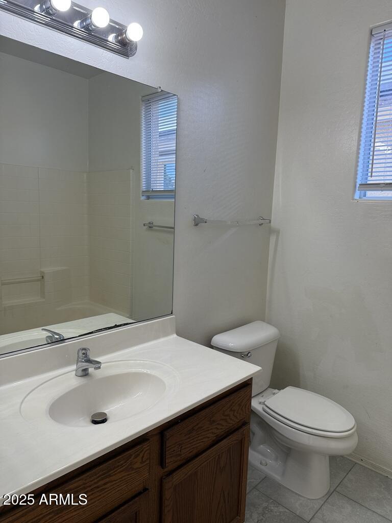 20915 East Via Del Rancho Queen Creek, AZ 85142 - Photo 18 of 23 a bathroom with a sink a toilet and mirror