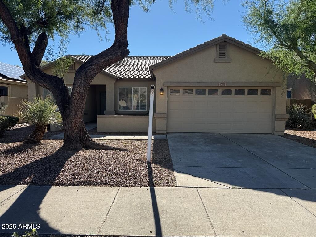 20915 East Via Del Rancho Queen Creek, AZ 85142 - Photo 2 of 23 a front view of a house with garden
