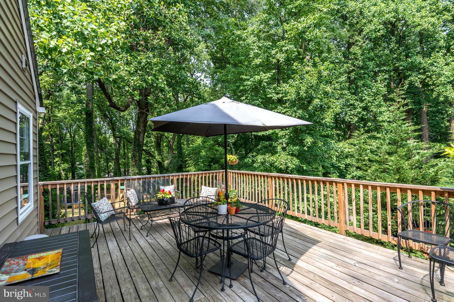 1240 Maple Road Arnold, MD 21012 - Photo 2 of 30 Grilling Deck Overlooking Tree-Bordered Yard