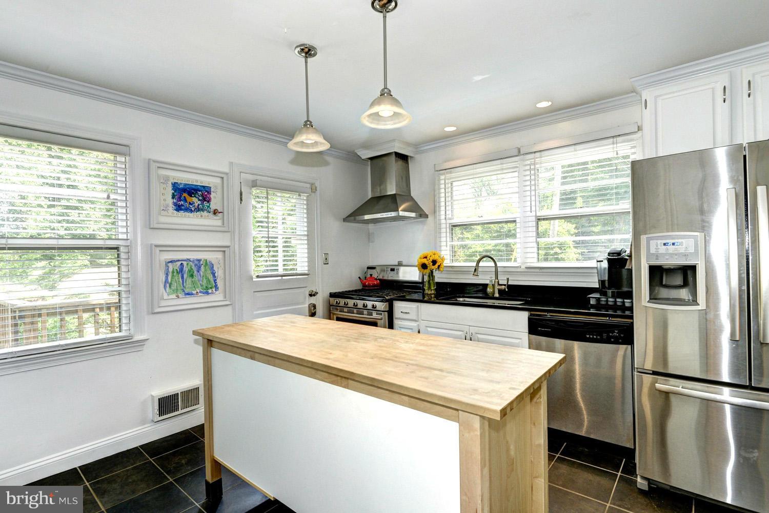 1240 Maple Road Arnold, MD 21012 - Photo 14 of 30 Tile Floor Reflecting Bistro Pendant Lighting