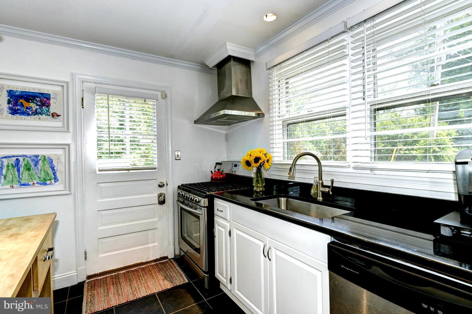 1240 Maple Road Arnold, MD 21012 - Photo 15 of 30 Sleek Stainless Appliances and Granite Counters