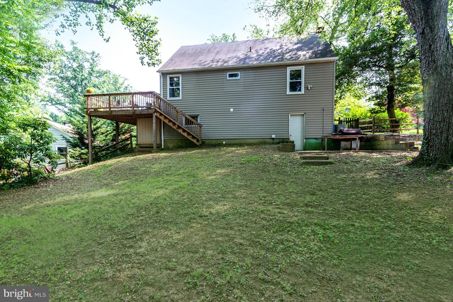 1240 Maple Road Arnold, MD 21012 - Photo 17 of 30 Raised Deck Overlooking Verdant Yard