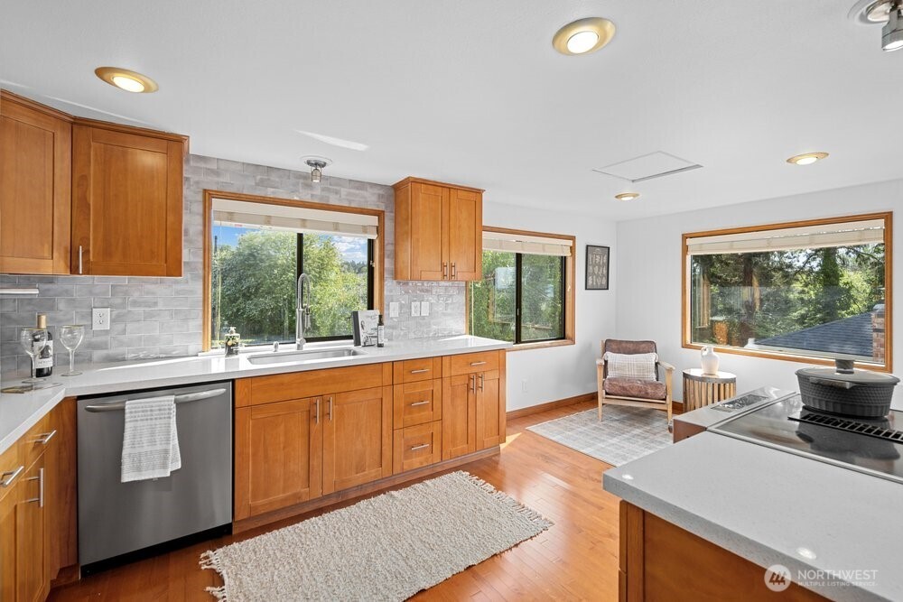 902 7th Avenue South Edmonds, WA 98020 - Photo 13 of 31 a large kitchen with kitchen island a large window in it