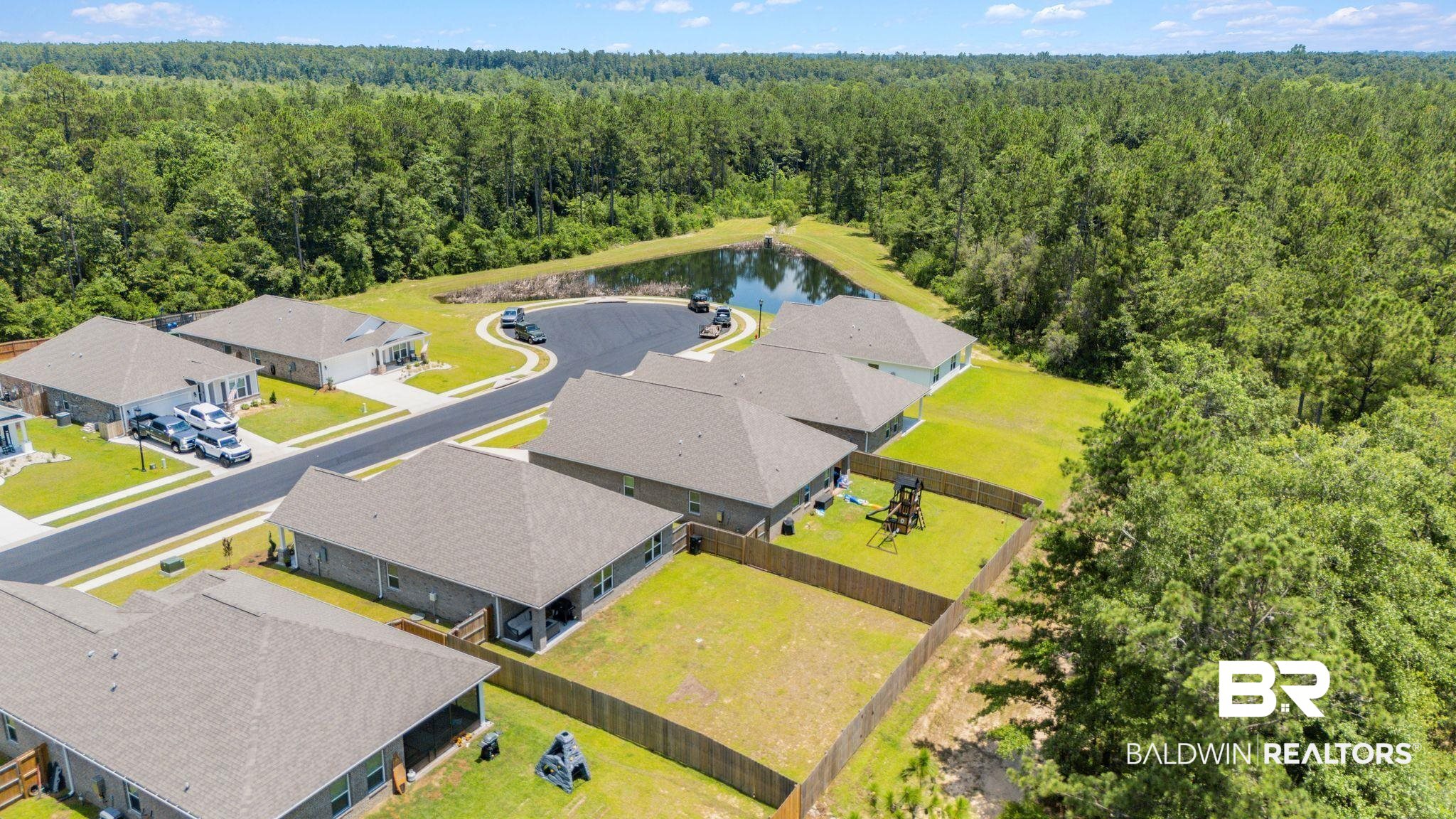 13966 Antler Hl Road Daphne, AL 36527 - Photo 42 of 44 Aerial perspective of a residential community featuring multiple single-story homes with shingle roofs and fenced backyards