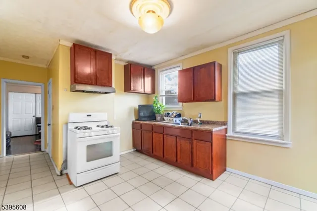 a kitchen with stainless steel appliances granite countertop a stove and a sink