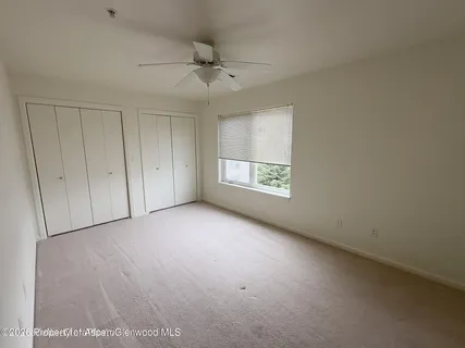 an empty room with a empty space and a window