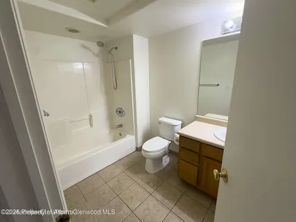 a bathroom with a toilet a sink and a bathtub