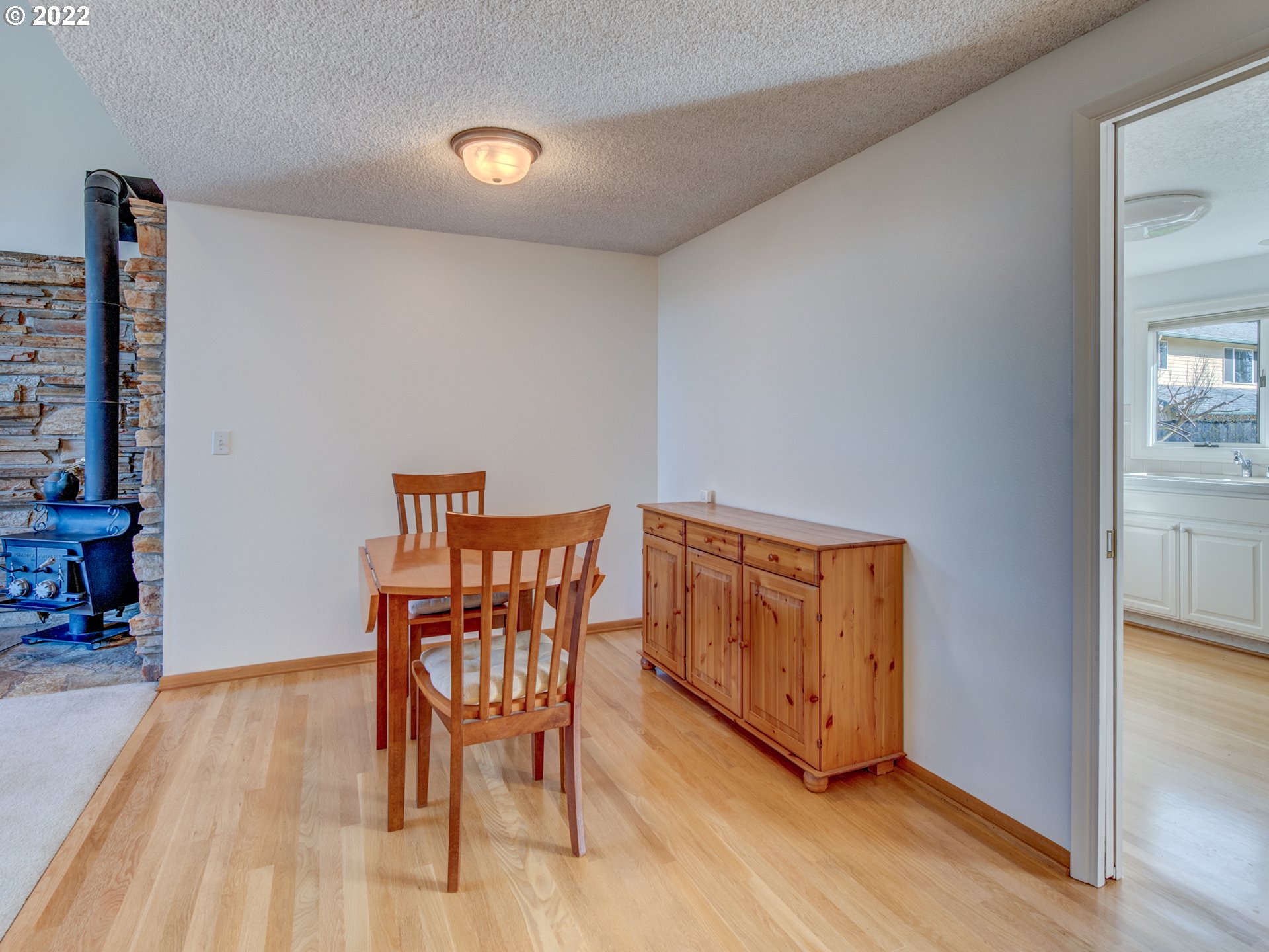 717 Edgemont Way Springfield, OR 97477 - Photo 8 of 32 a view of a room with furniture and wooden floor