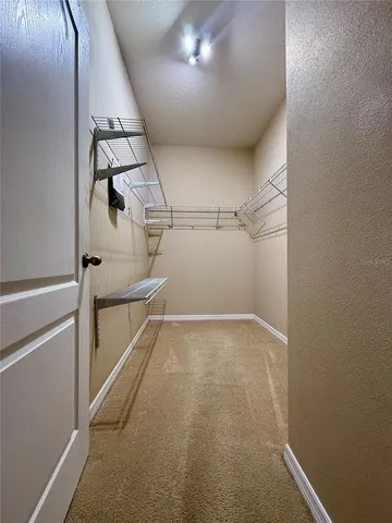 a bathroom with a double vanity sink mirror and shower