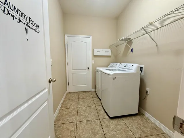 a utility room with washer and dryer