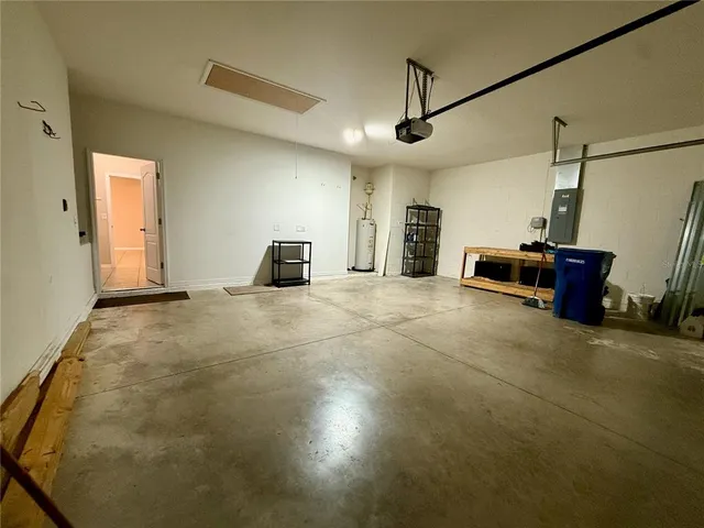 an empty room with large windows