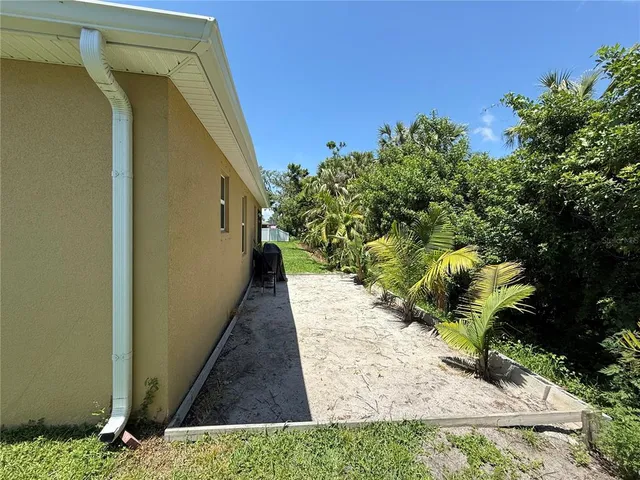 a backyard of a house with lots of green space