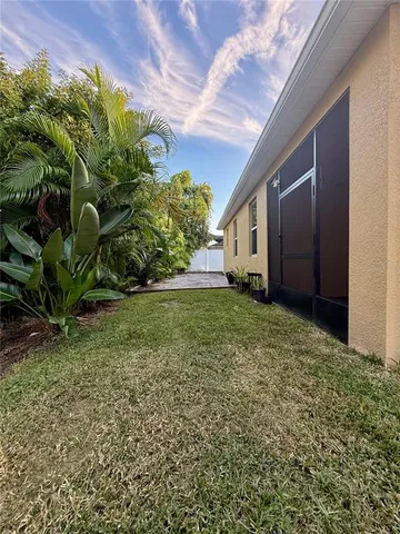 a backyard of a house with lots of green space