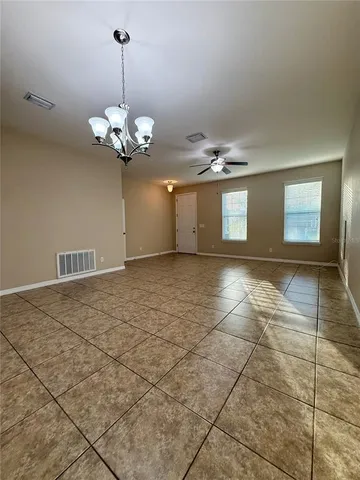 a view of a room with a chandelier