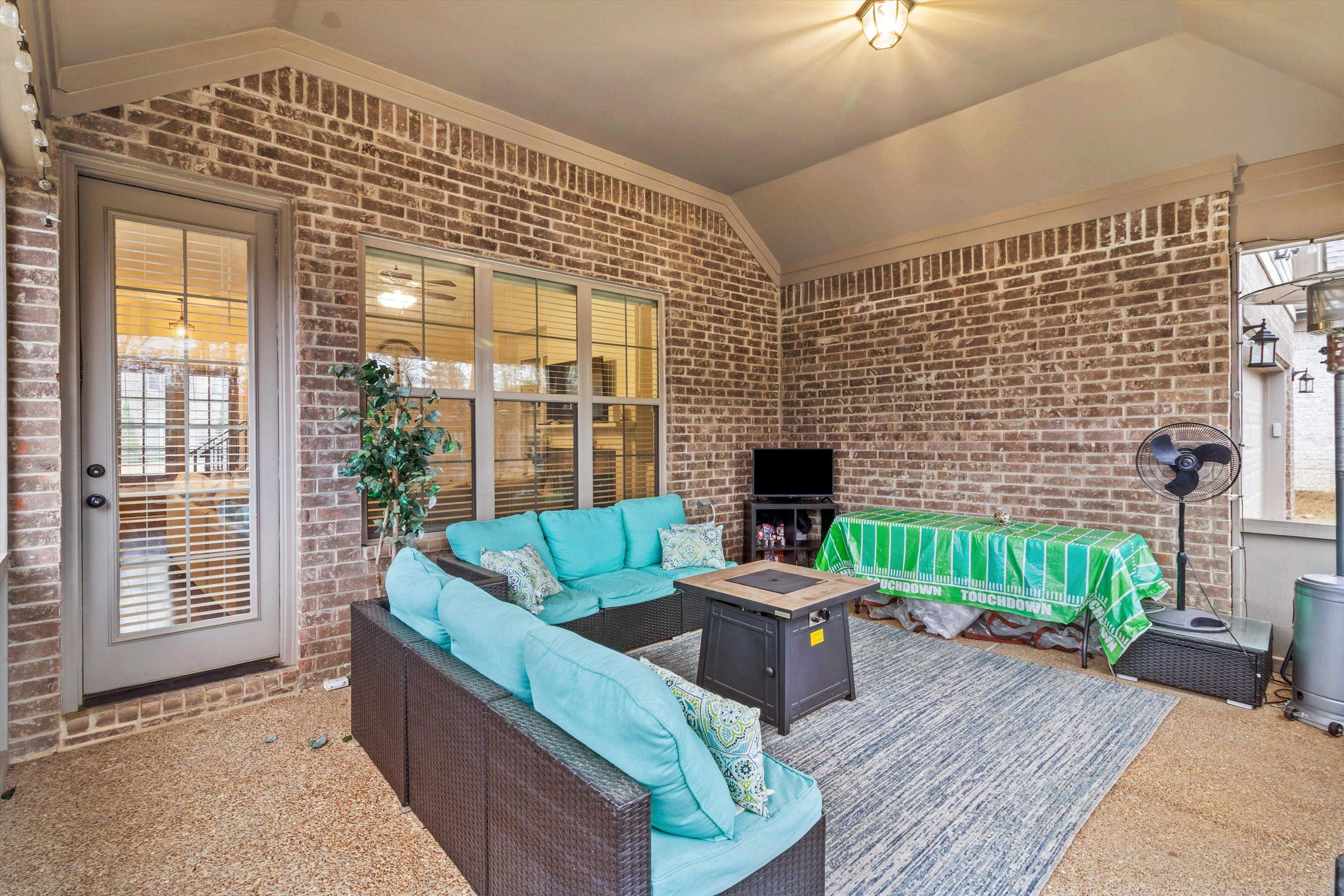 5504 Stonecrest Drive Olive Branch, MS 38654 - Photo 11 of 19 a living room with furniture a fireplace and a potted plant