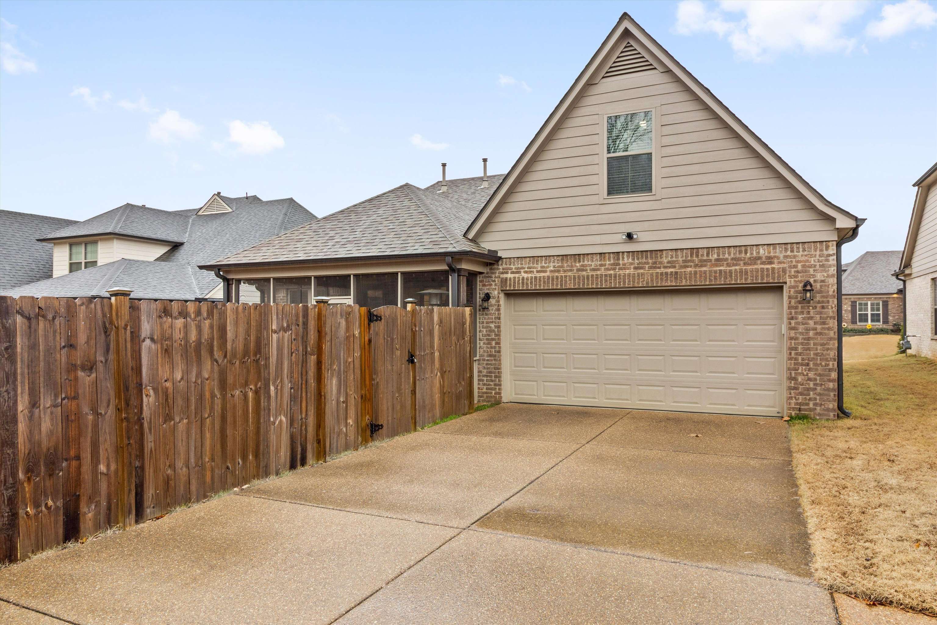 5504 Stonecrest Drive Olive Branch, MS 38654 - Photo 12 of 19 View of front facade featuring brick siding, a garage, concrete driveway, and roof with shingles