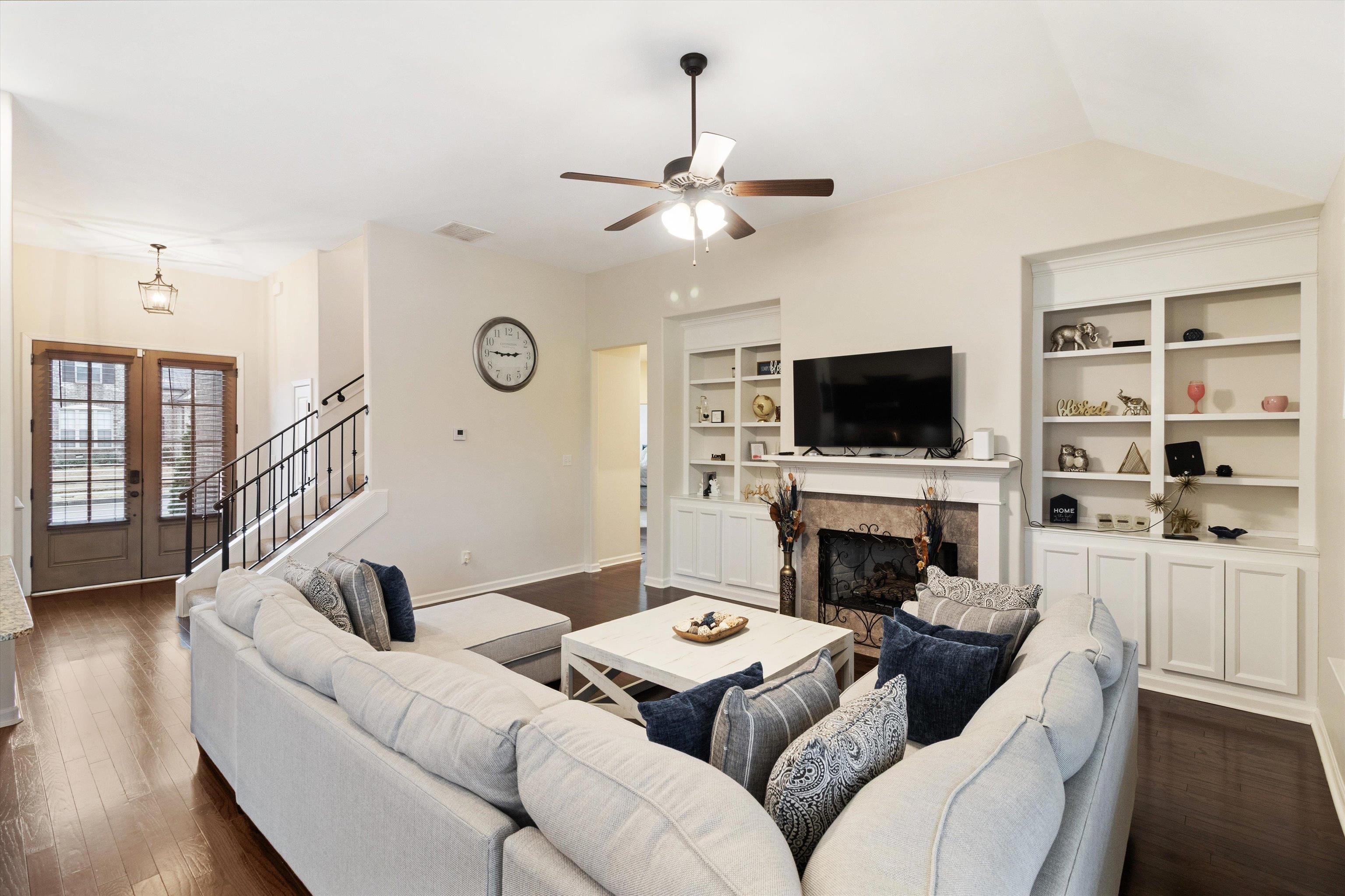 5504 Stonecrest Drive Olive Branch, MS 38654 - Photo 13 of 19 a living room with furniture a fireplace and a flat screen tv