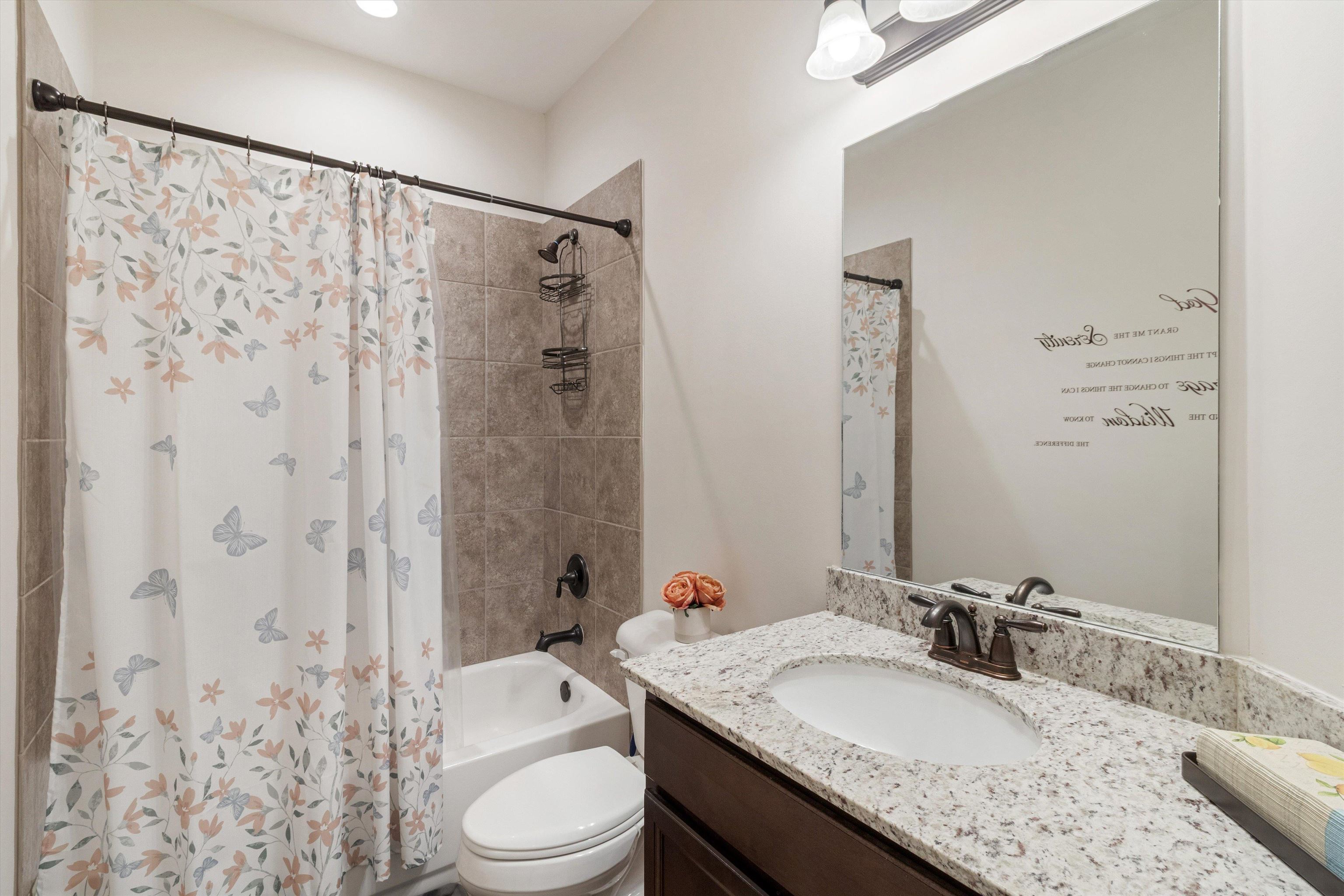 5504 Stonecrest Drive Olive Branch, MS 38654 - Photo 15 of 19 a bathroom with a granite countertop sink toilet a shower and a mirror