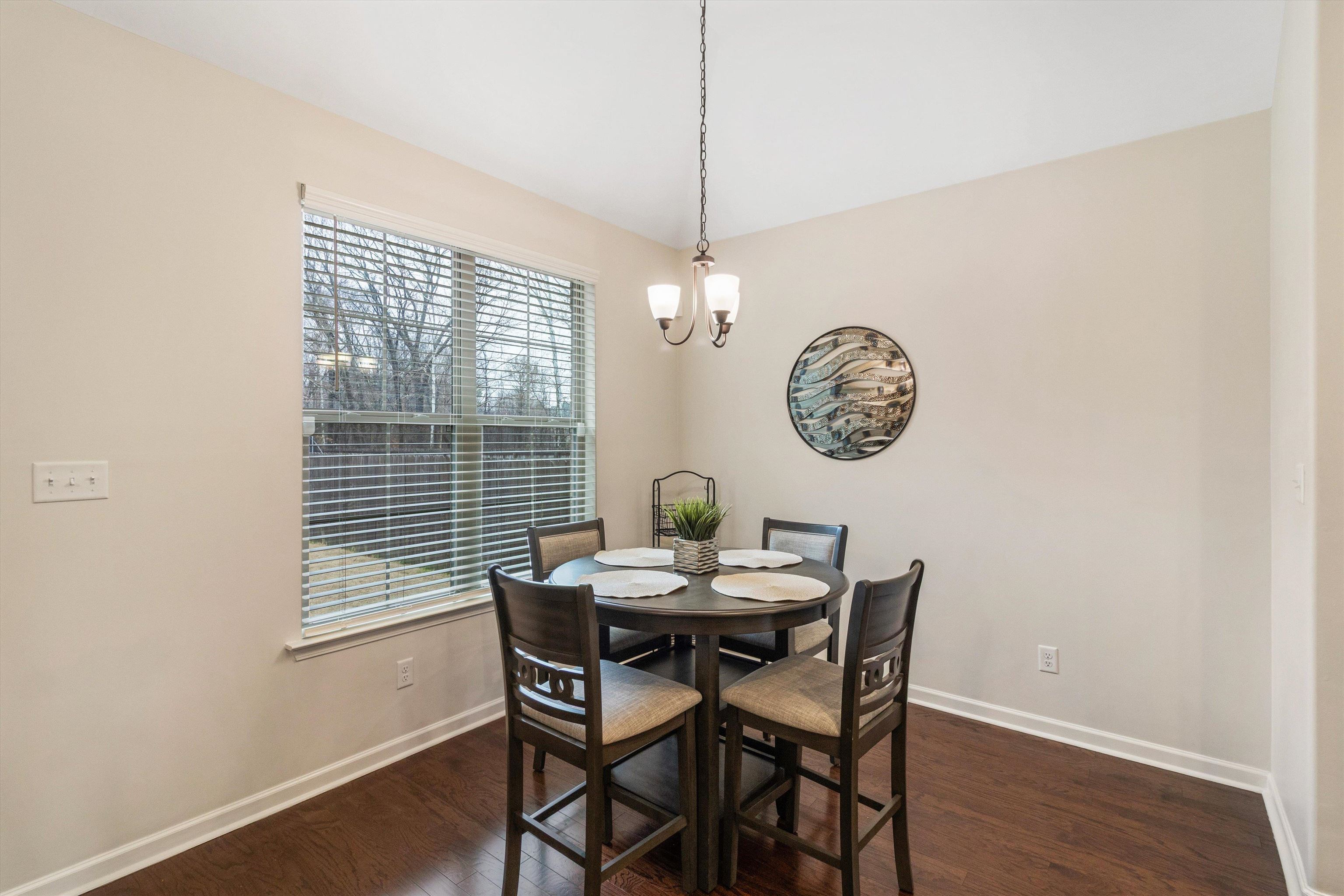 5504 Stonecrest Drive Olive Branch, MS 38654 - Photo 17 of 19 a dining room with a wooden table and a window