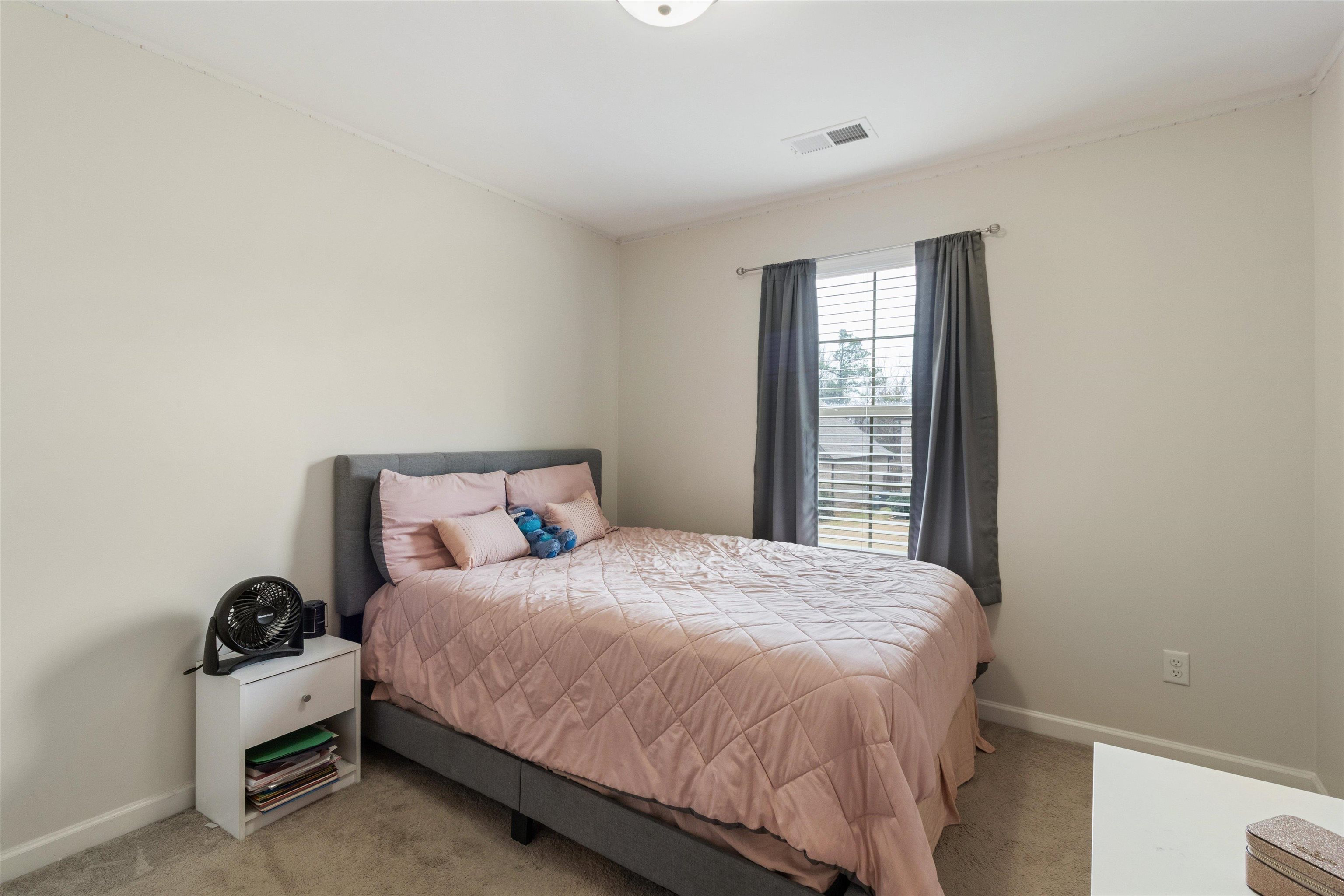 5504 Stonecrest Drive Olive Branch, MS 38654 - Photo 18 of 19 a bedroom with a bed and a window