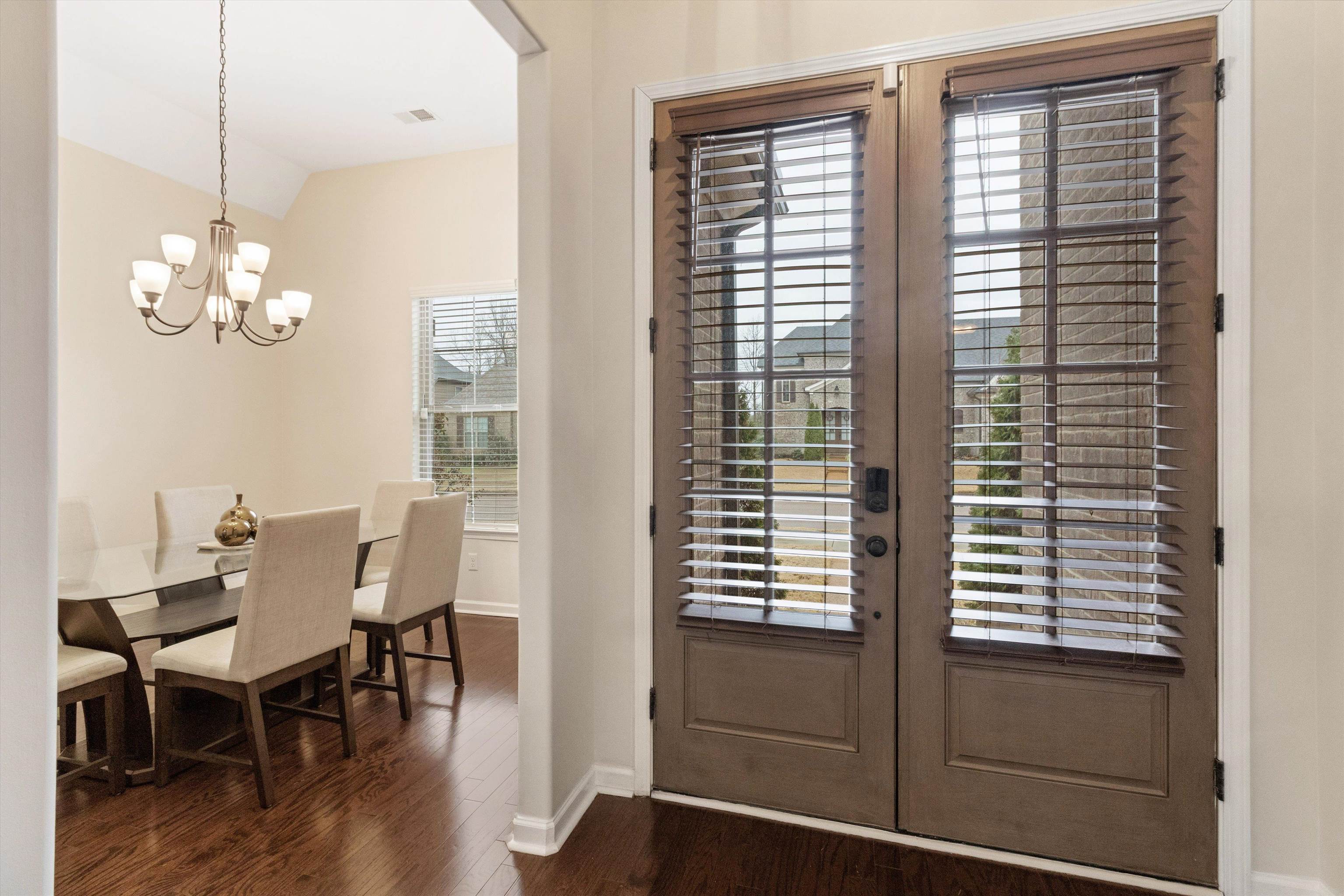 5504 Stonecrest Drive Olive Branch, MS 38654 - Photo 4 of 19 a view of a dining room with furniture and wooden floor