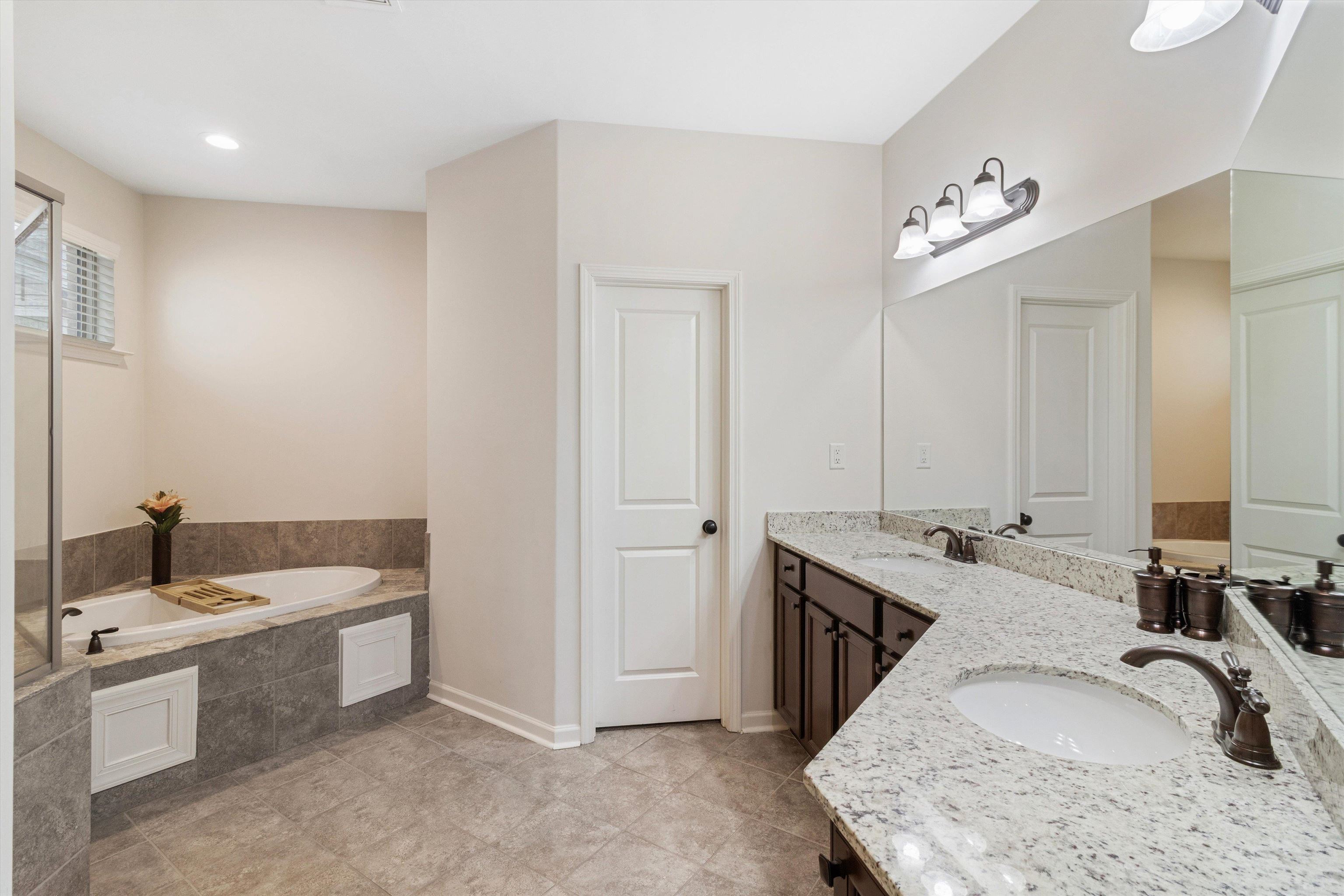 5504 Stonecrest Drive Olive Branch, MS 38654 - Photo 6 of 19 a bathroom with a sink double vanity and a mirror