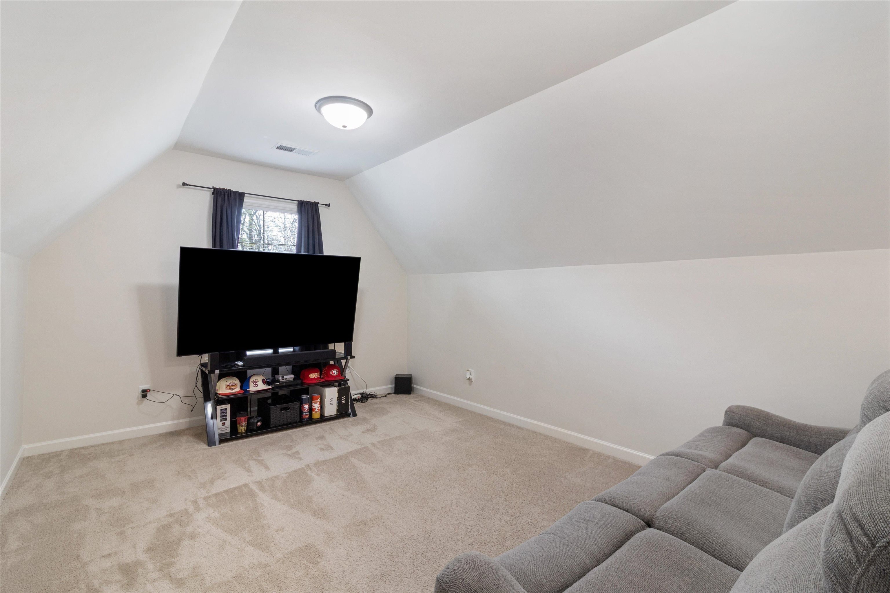 5504 Stonecrest Drive Olive Branch, MS 38654 - Photo 10 of 19 a living room with furniture and a flat screen tv