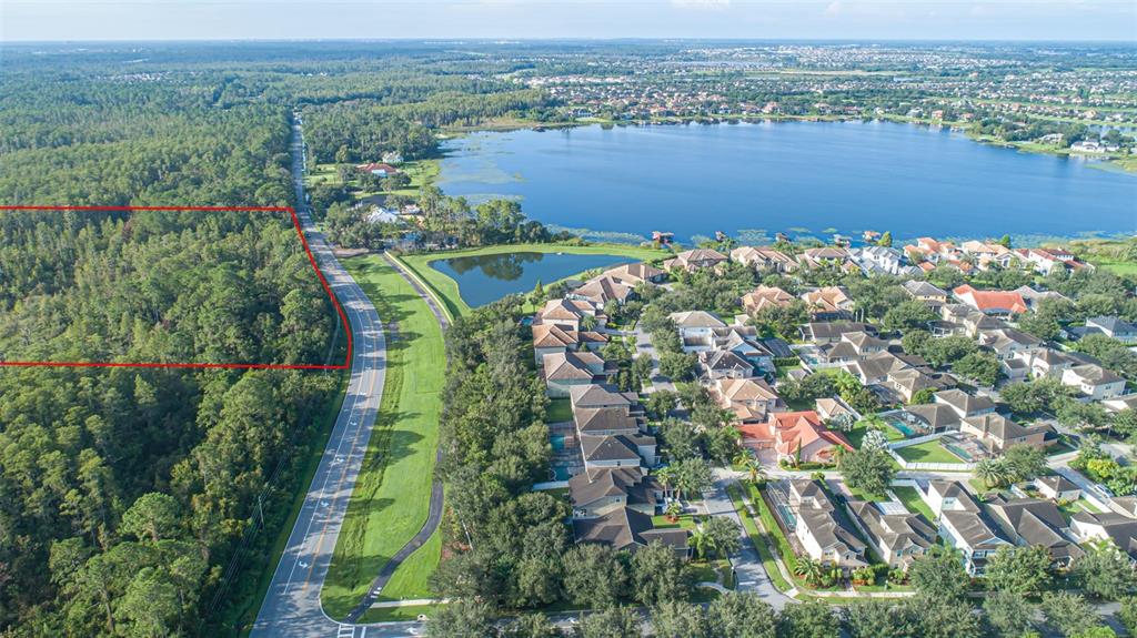 7545 Ficquette Road Windermere, FL 34786 - Photo 6 of 23 an aerial view of a houses with a yard and lake view