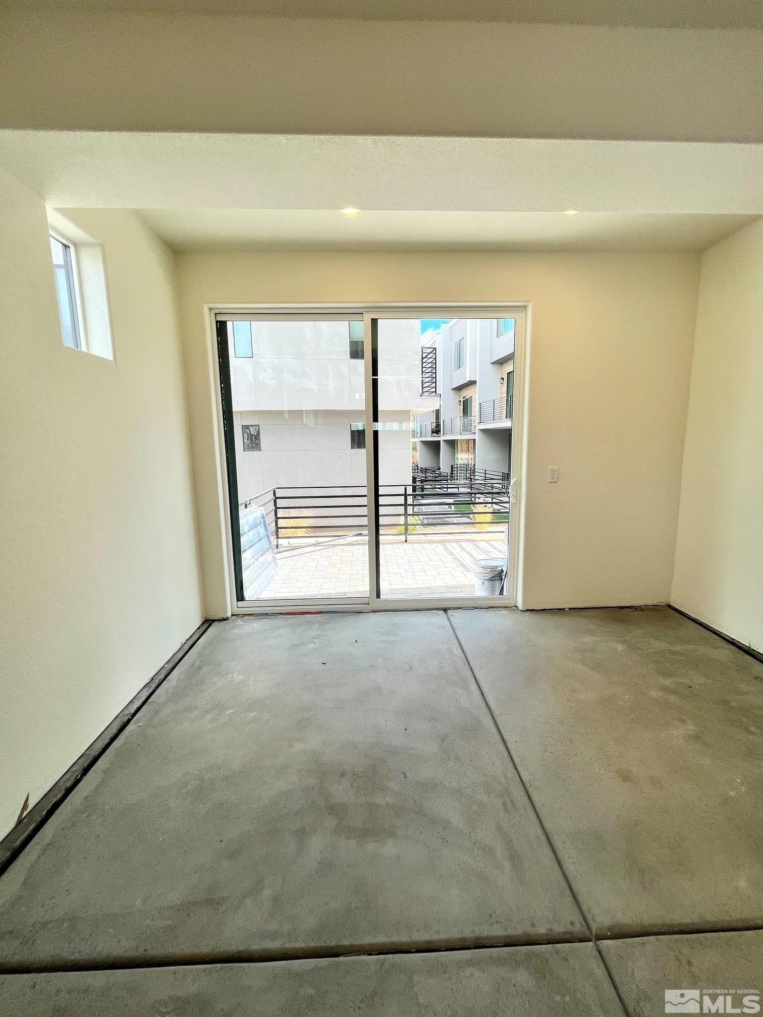 156 Rissone Lane, Unit LOT 33 Reno, NV 89503 - Photo 5 of 21 a view of an empty room and window