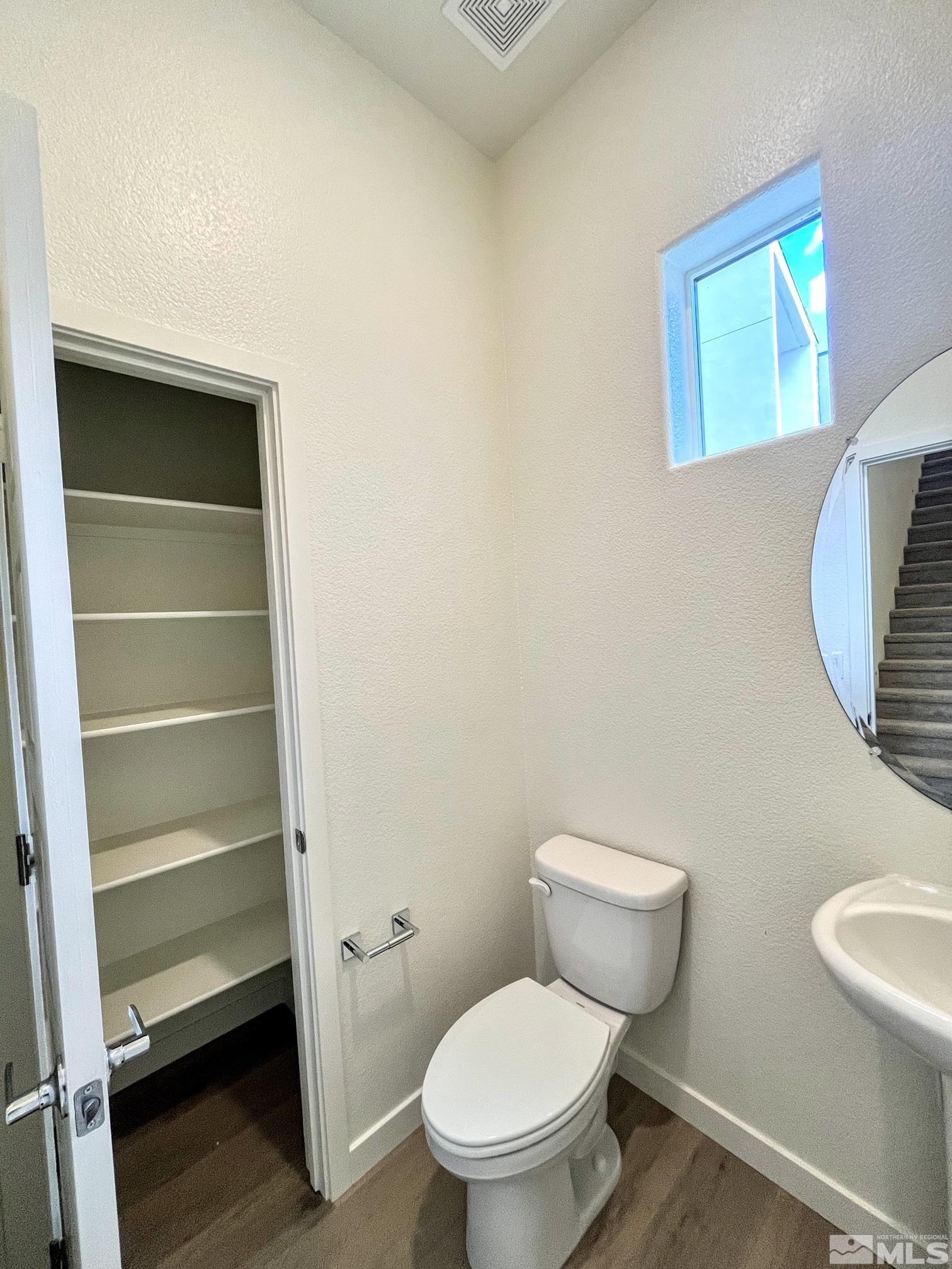 156 Rissone Lane, Unit LOT 33 Reno, NV 89503 - Photo 10 of 21 a white toilet sitting next to a shower
