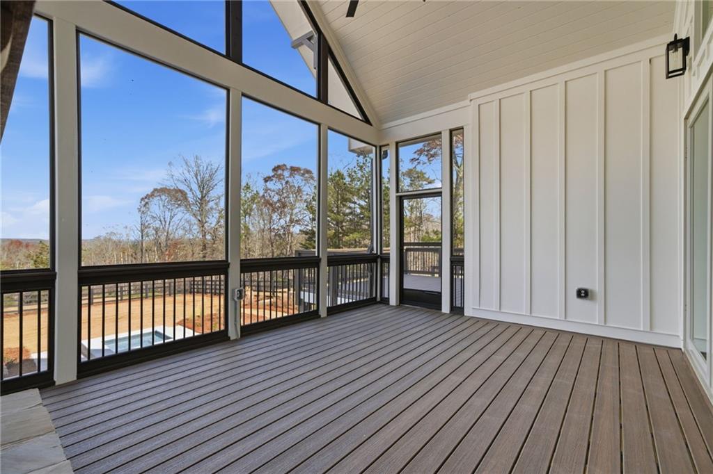 5364 Price Road Gainesville, GA 30506 - Photo 46 of 59 a view of a porch with wooden floor and iron stairs