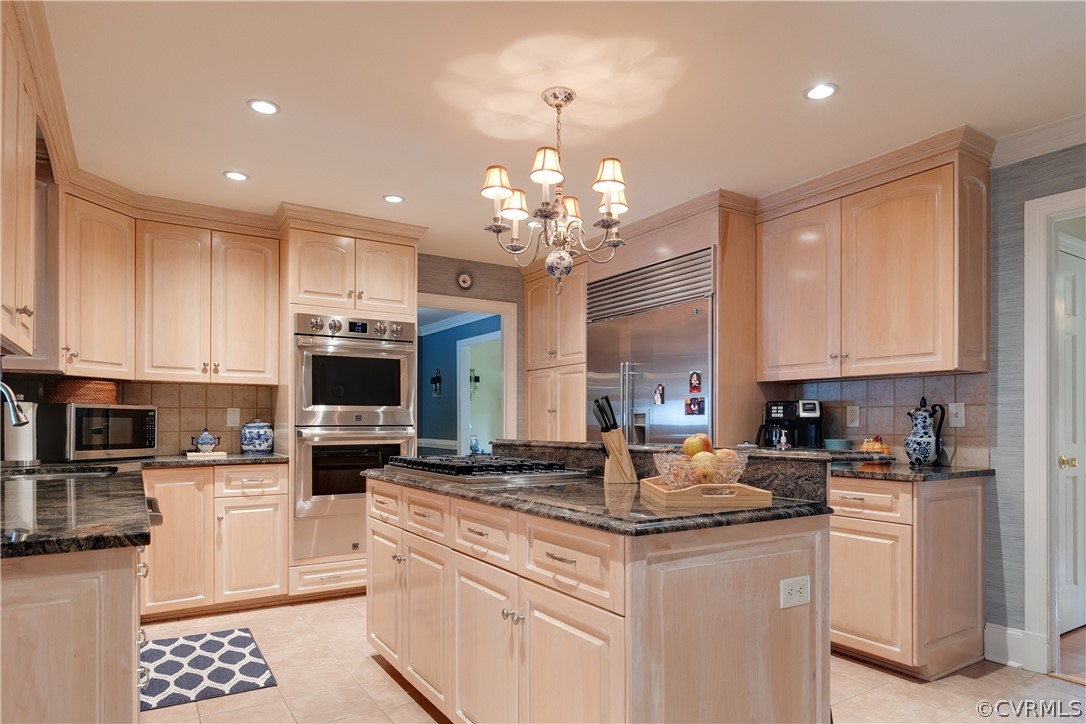 13710 Thorngate Road Midlothian, VA 23113 - Photo 26 of 48 a kitchen with kitchen island granite countertop a sink stainless steel appliances and white cabinets