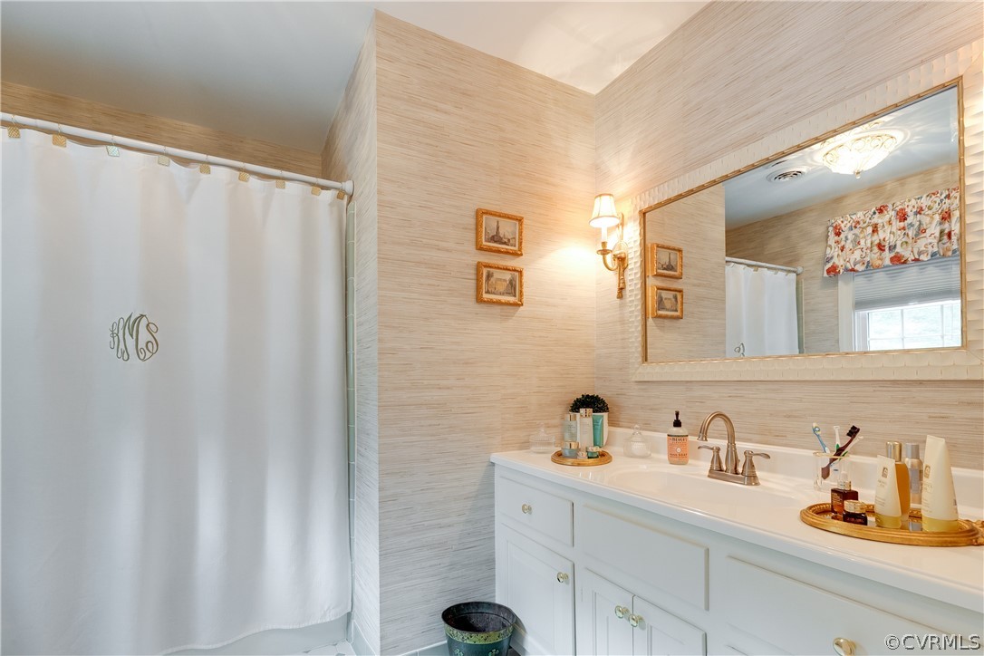 13710 Thorngate Road Midlothian, VA 23113 - Photo 30 of 48 a bathroom with a sink and a mirror