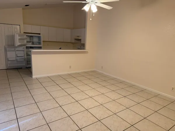a stove top oven sitting inside of a kitchen