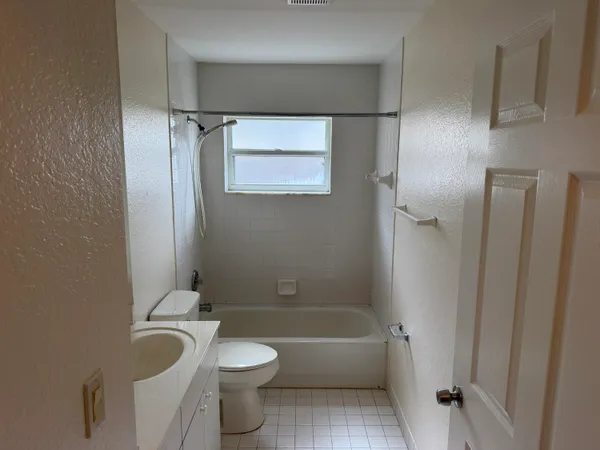 a view of a chandelier fan and a closet