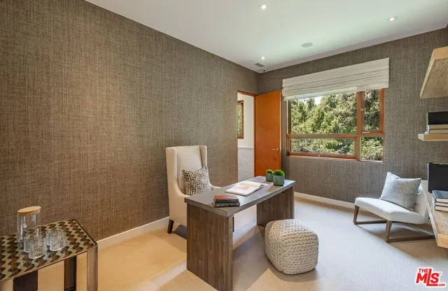 a view of a patio with table and chairs with wooden floor and fence