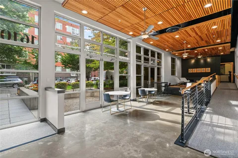 a building outdoor space with patio furniture and potted plants