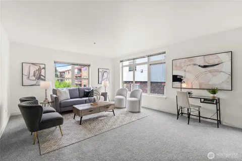 a living room with furniture and a table