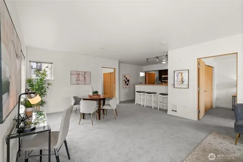 a view of a livingroom with furniture and a flat screen tv