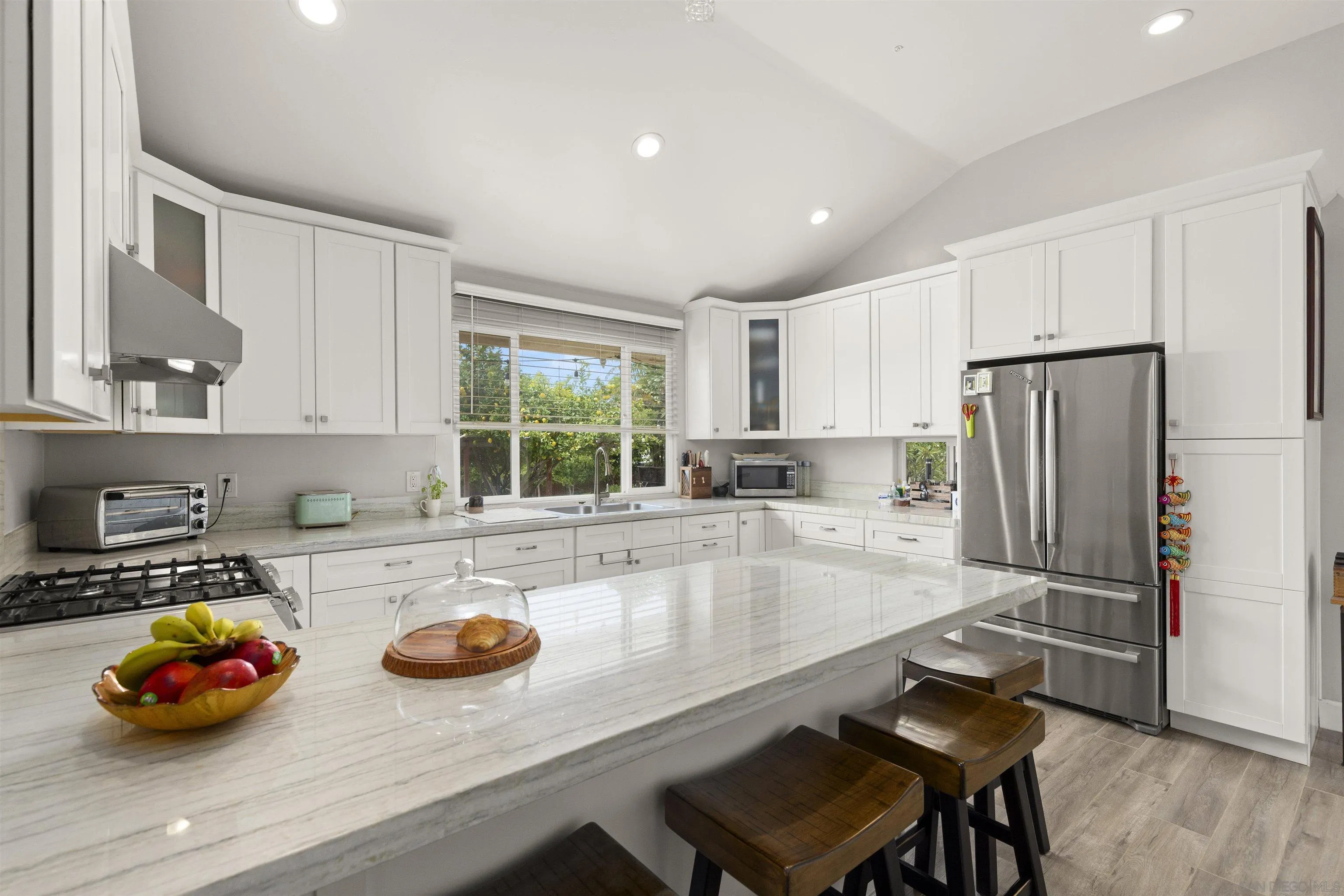 752 Bracero Road Encinitas, CA 92024 - Photo 16 of 46 a kitchen with stainless steel appliances a sink a stove and refrigerator