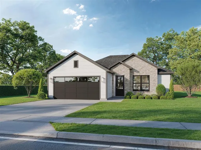 a view of a house with a yard and large trees
