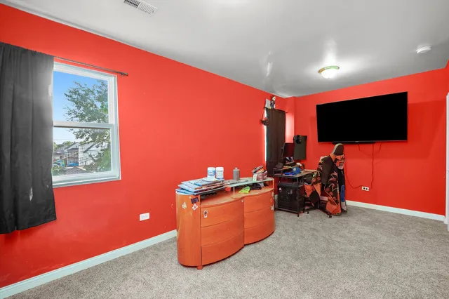 a room with furniture and a flat screen tv