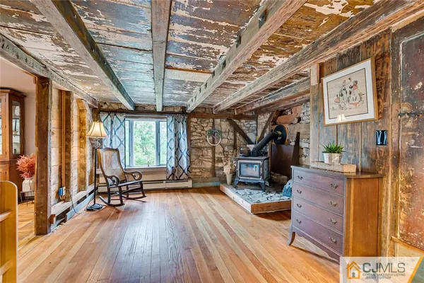 a view of living room with furniture and wooden floor
